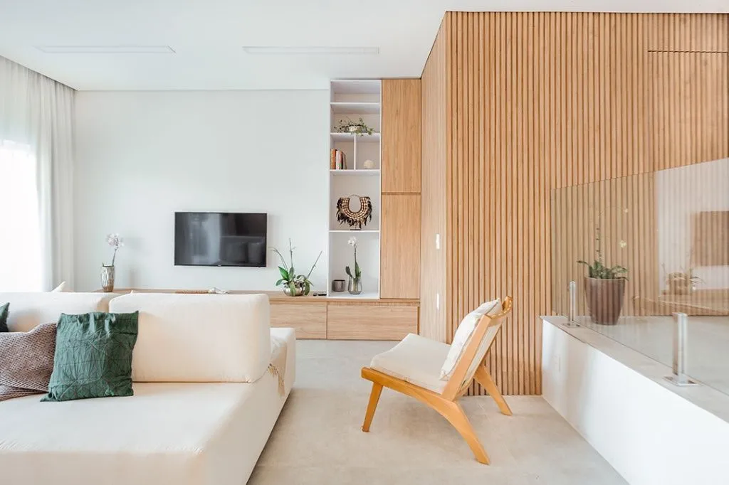 Interior contemporâneo com mobiliário design e iluminação estratégica - Fotografia de arquitetura por Pâmela Wille